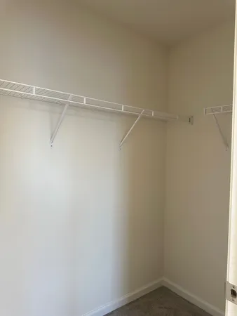 a view of an empty walk in closet