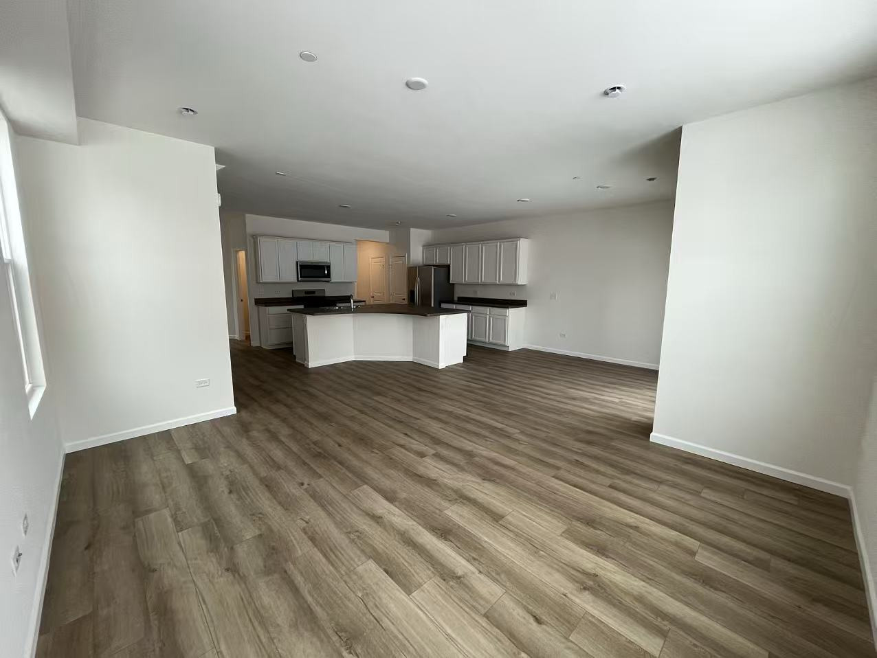 5922 Hawkweed Drive Plainfield, IL 60585 - Photo 5 of 19 a view of kitchen and wooden floor
