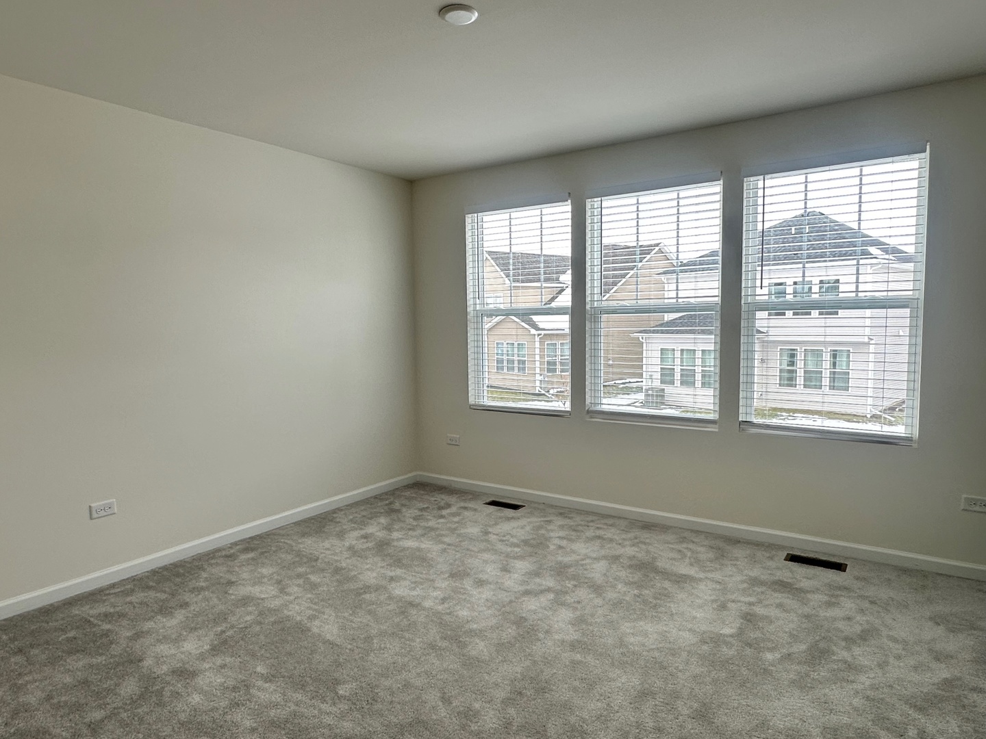 5922 Hawkweed Drive Plainfield, IL 60585 - Photo 8 of 19 a view of an empty room with a window
