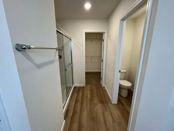 a view of a bathroom from a hallway