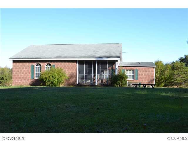 12110 Smokey Lane Rice, VA 23966 - Photo 1 of 14 a front view of a house with a garden