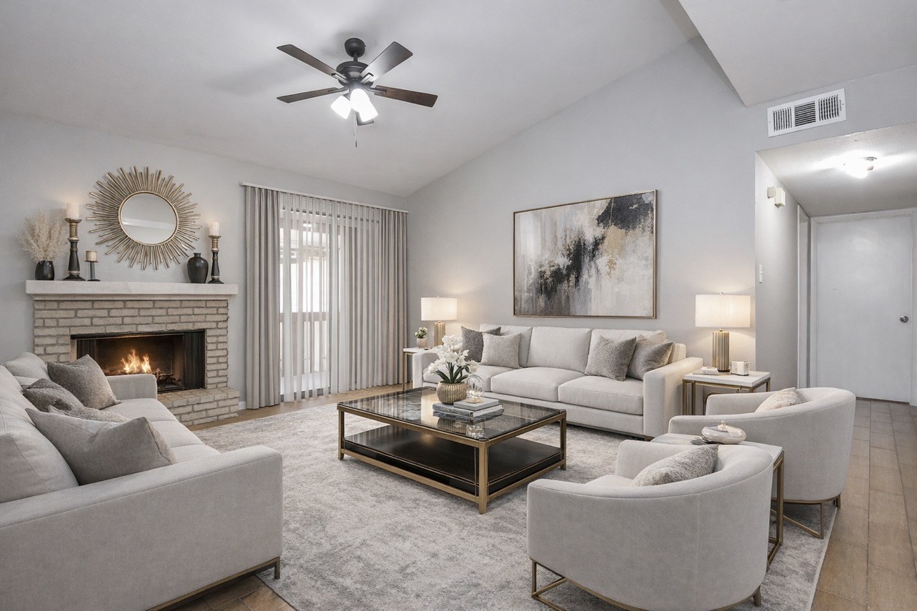 a living room with furniture and a fireplace