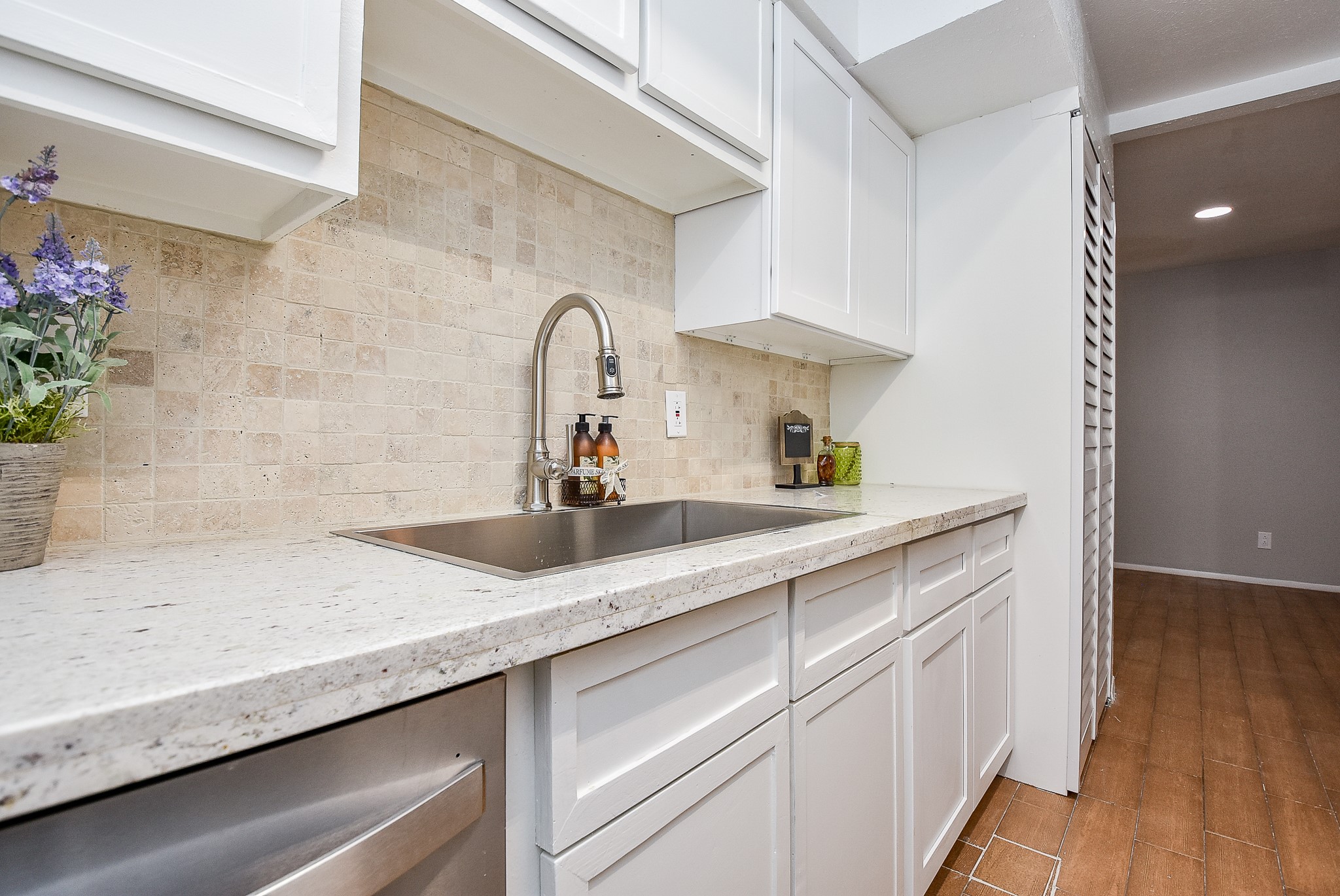 5000 Milwee Street, Unit 74 Houston, TX 77092 - Photo 12 of 35 a kitchen with a sink and cabinets