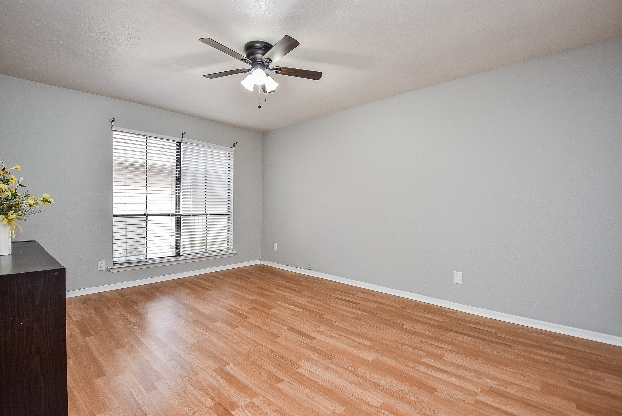5000 Milwee Street, Unit 74 Houston, TX 77092 - Photo 20 of 35 an empty room with wooden floor and windows