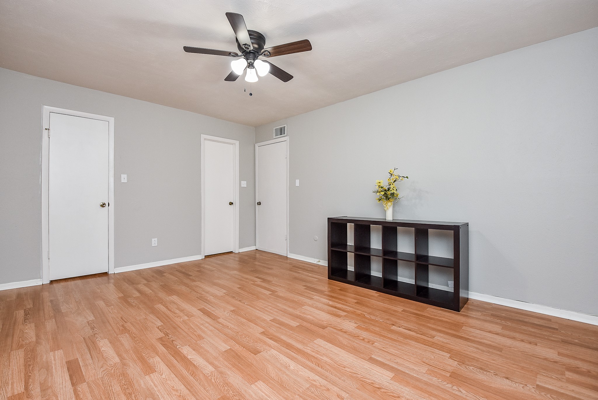 5000 Milwee Street, Unit 74 Houston, TX 77092 - Photo 22 of 35 a bedroom with a bed and a chandelier