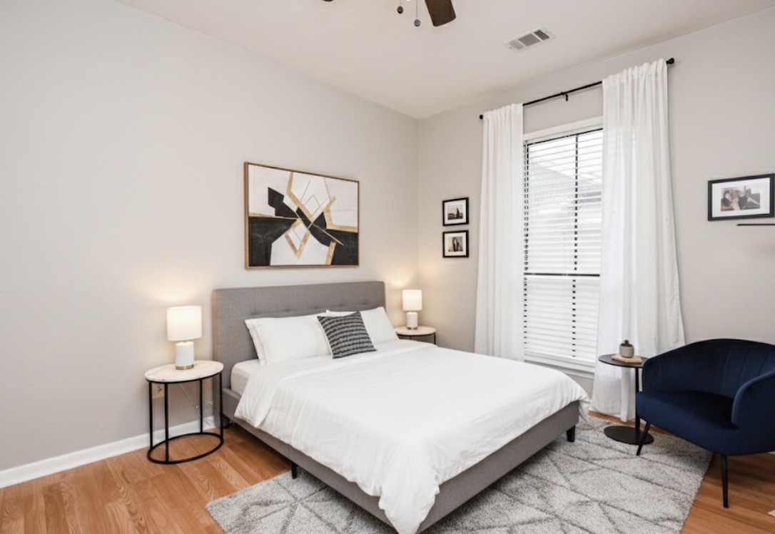 5000 Milwee Street, Unit 74 Houston, TX 77092 - Photo 26 of 35 a bedroom with a bed and a chair