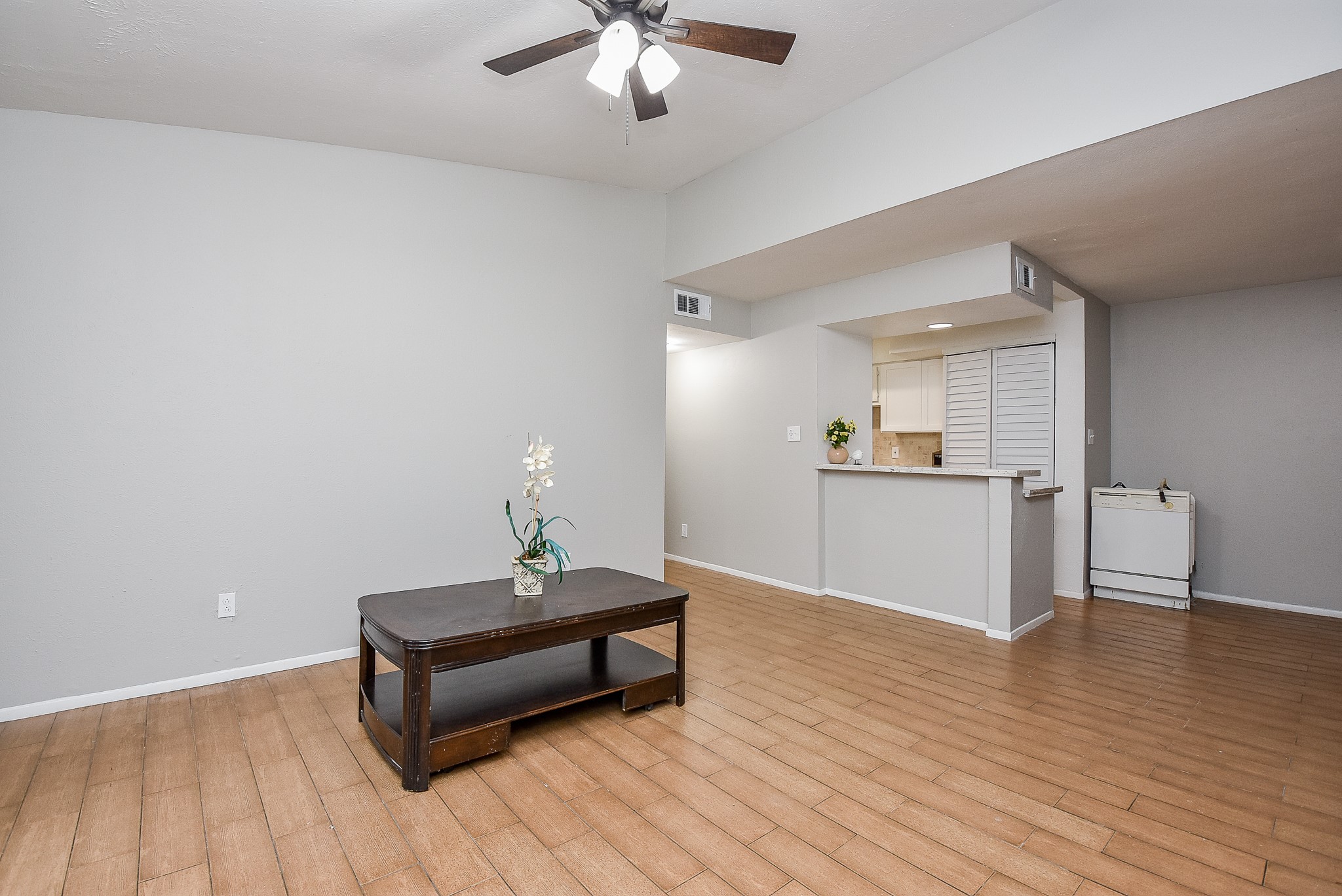 5000 Milwee Street, Unit 74 Houston, TX 77092 - Photo 6 of 35 a living room with a couch and chandelier