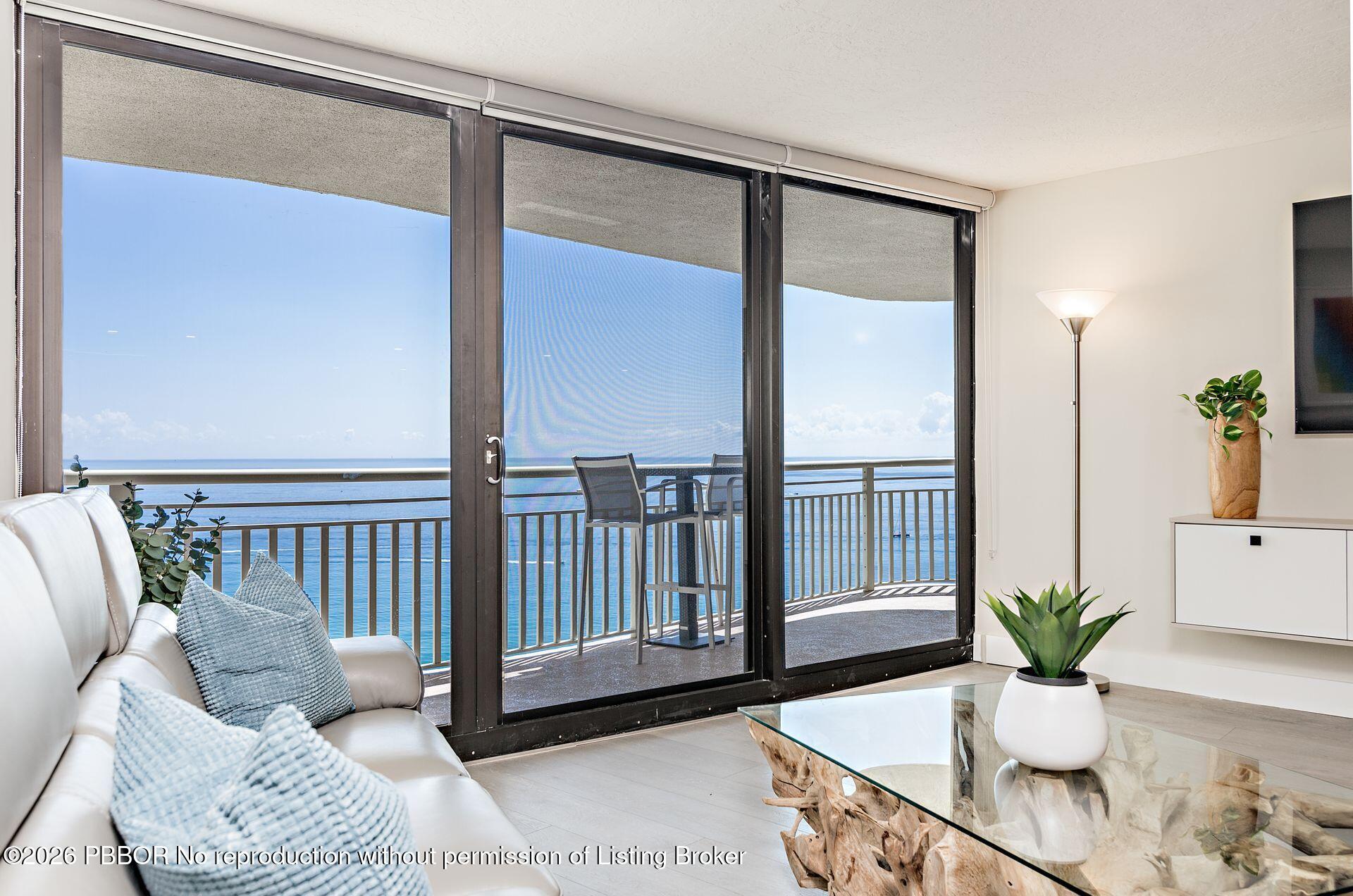 3000 North Ocean Drive, Unit 32E Riviera Beach, FL 33404 - Photo 17 of 36 a living room with furniture