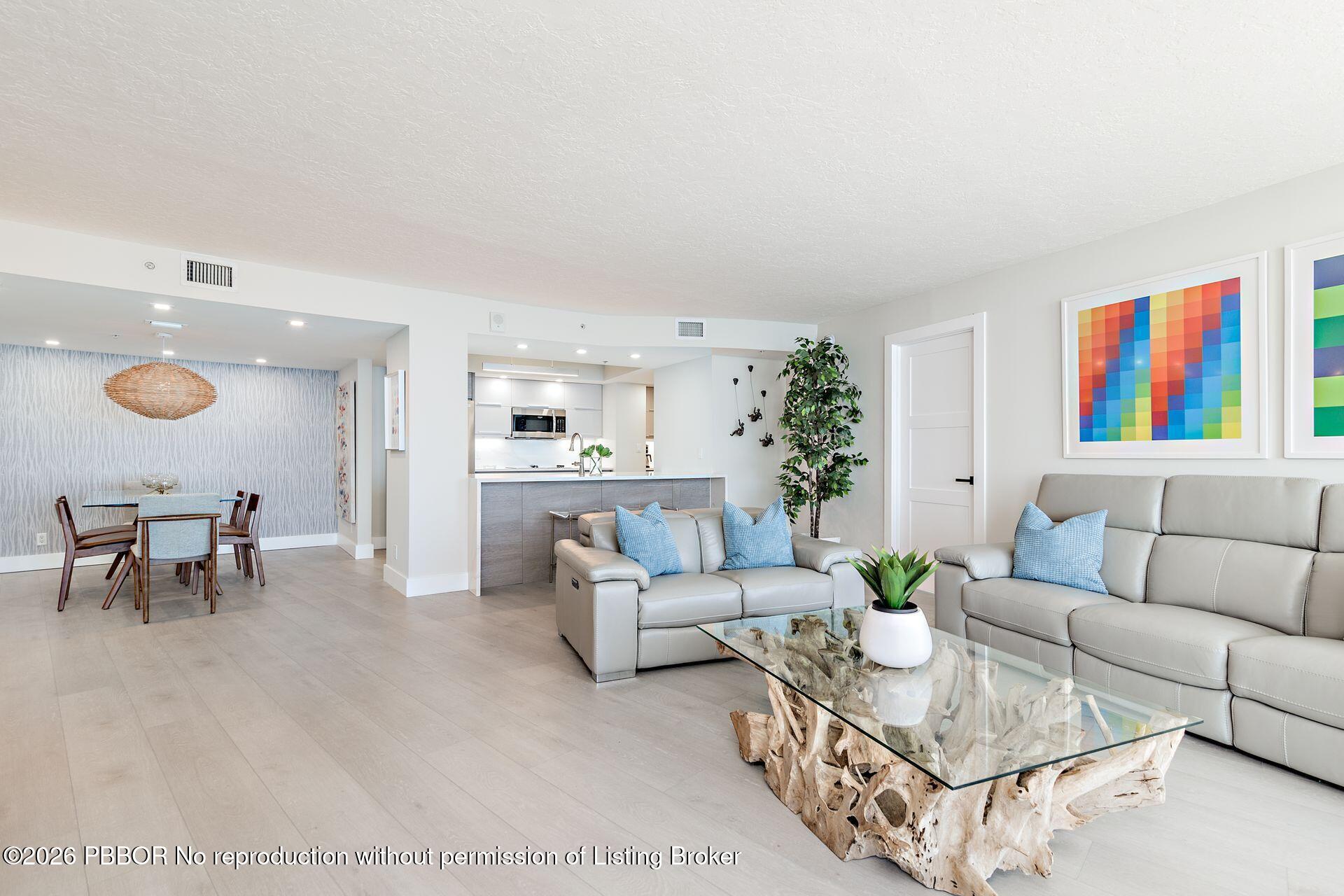 3000 North Ocean Drive, Unit 32E Riviera Beach, FL 33404 - Photo 18 of 36 a living room with furniture and a rug