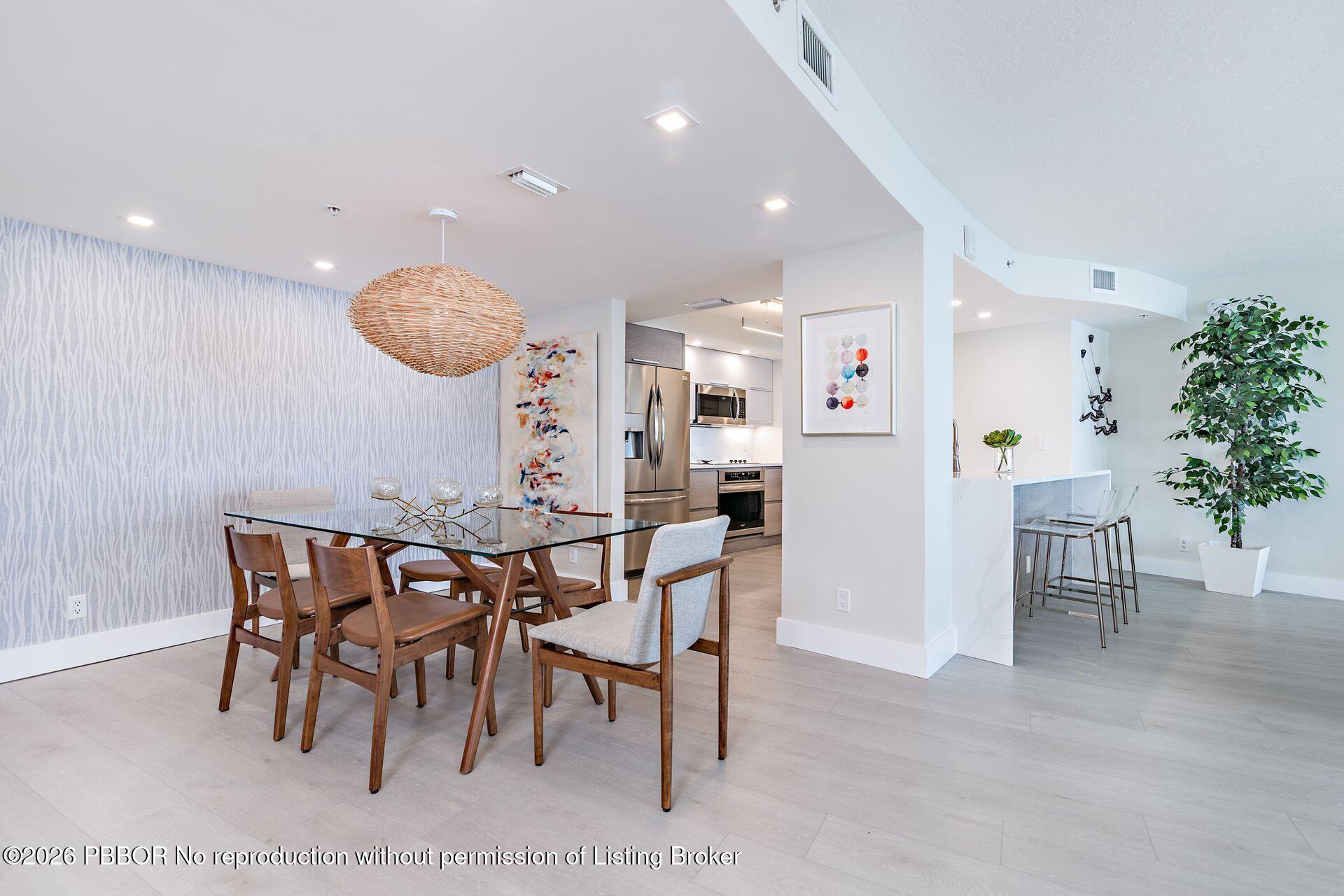 3000 North Ocean Drive, Unit 32E Riviera Beach, FL 33404 - Photo 19 of 36 a view of a dining room with furniture