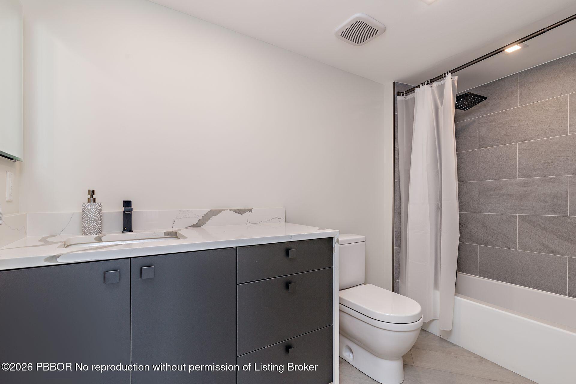 3000 North Ocean Drive, Unit 32E Riviera Beach, FL 33404 - Photo 28 of 36 a bathroom with a sink a toilet and shower