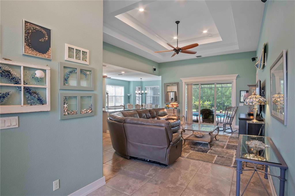 114 Venice Road Rotonda West, FL 33947 - Photo 18 of 88 a living room with furniture and a floor to ceiling window