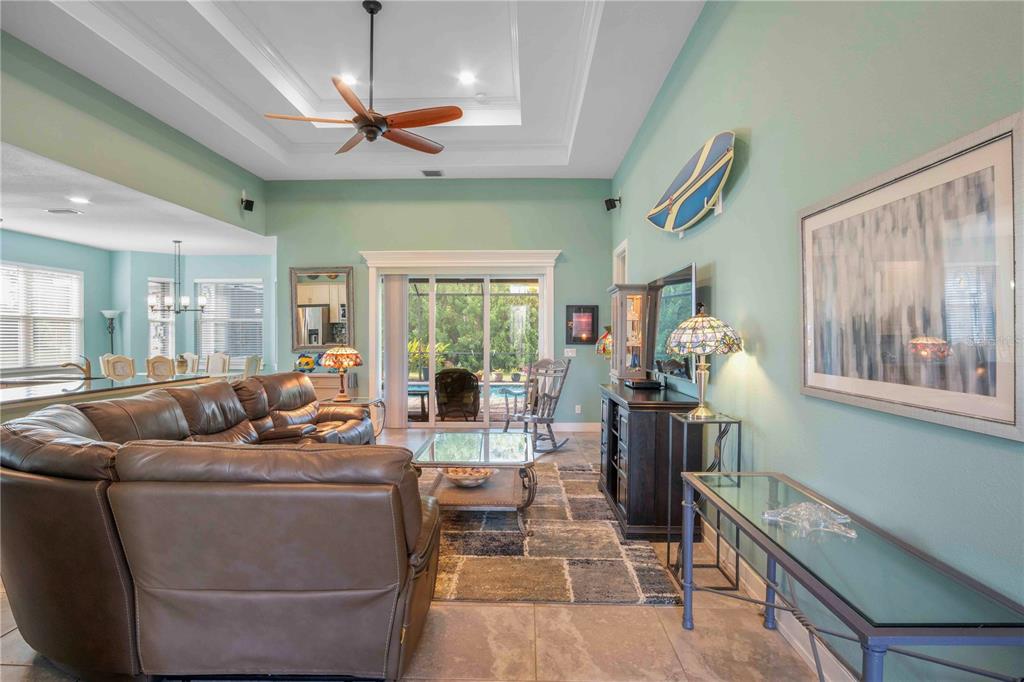 114 Venice Road Rotonda West, FL 33947 - Photo 19 of 88 a living room with furniture and a large window