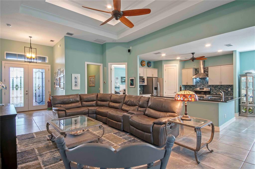 114 Venice Road Rotonda West, FL 33947 - Photo 20 of 88 a living room with furniture and a large window