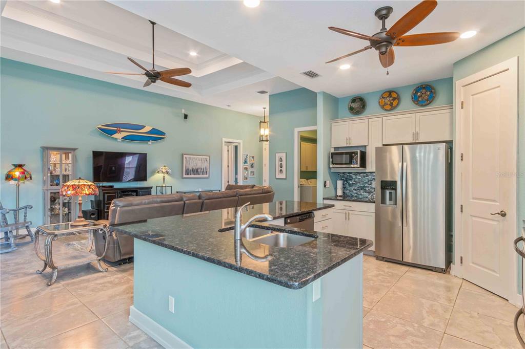 114 Venice Road Rotonda West, FL 33947 - Photo 23 of 88 a kitchen with stainless steel appliances granite countertop a sink a stove and a refrigerator
