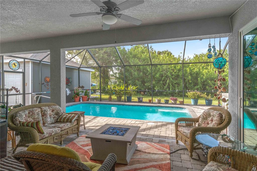 114 Venice Road Rotonda West, FL 33947 - Photo 35 of 88 a living room with furniture and a large window