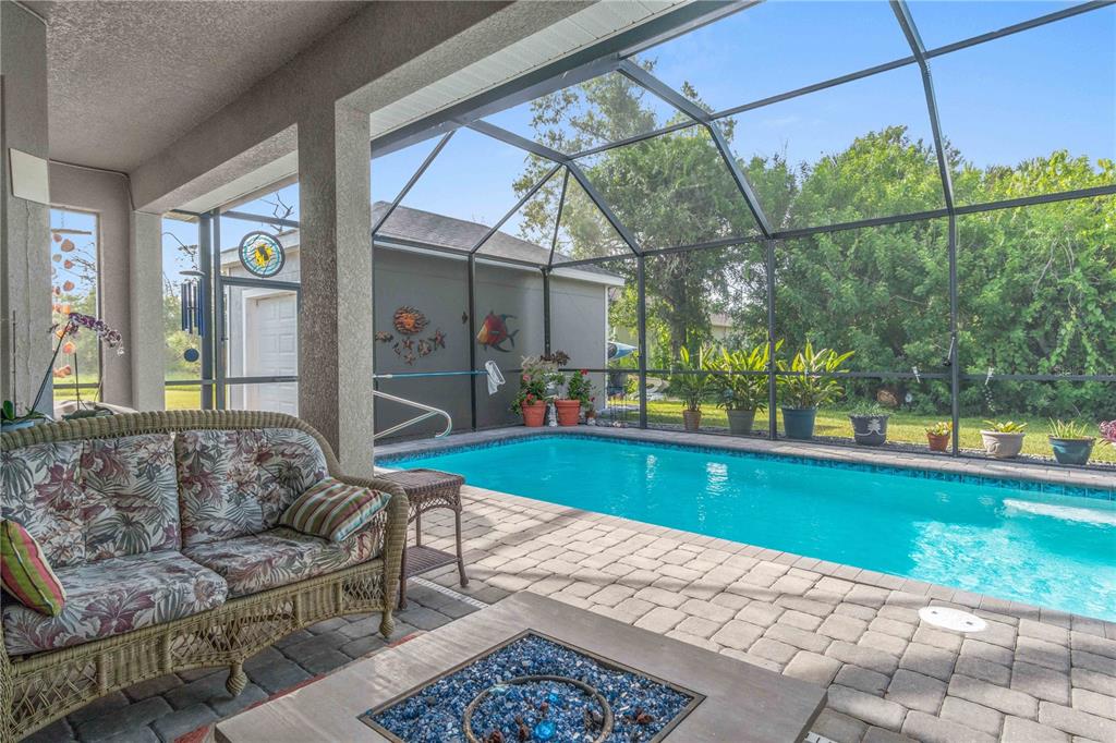 114 Venice Road Rotonda West, FL 33947 - Photo 36 of 88 a living room with furniture and a large window
