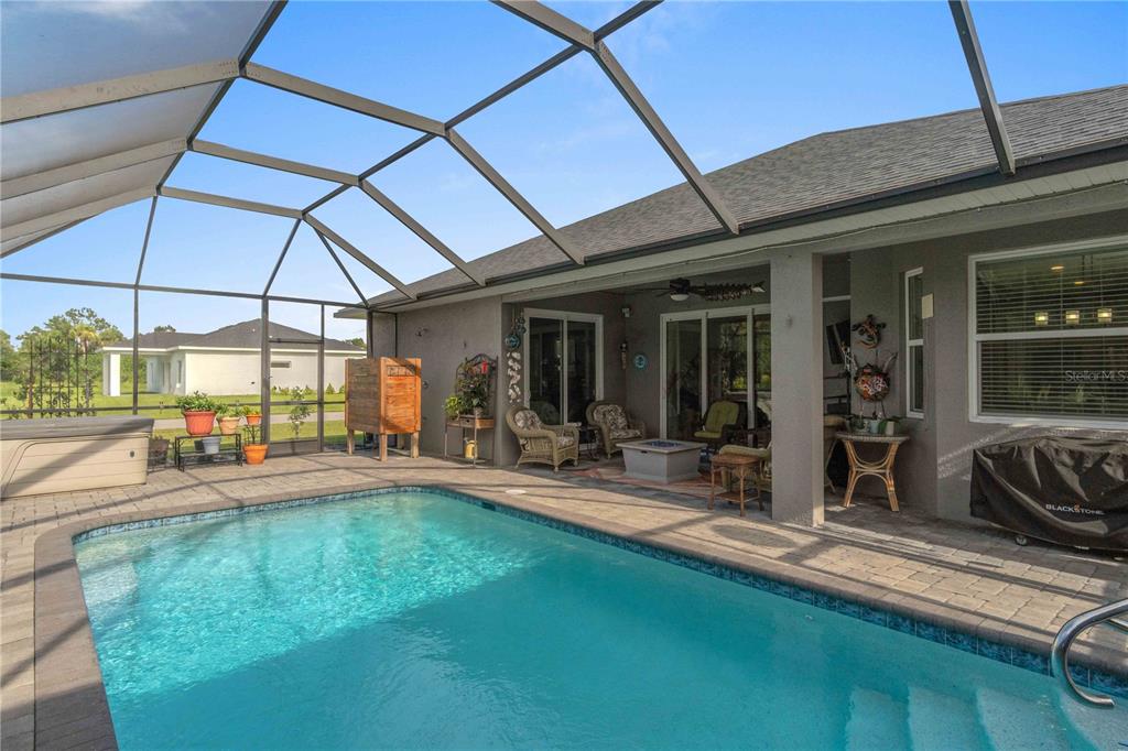 114 Venice Road Rotonda West, FL 33947 - Photo 40 of 88 a house view with a sitting space and garden space