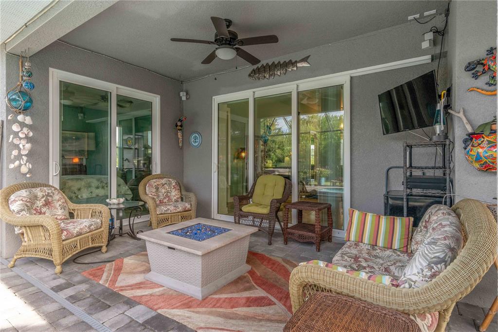 114 Venice Road Rotonda West, FL 33947 - Photo 42 of 88 a living room with furniture and a large window