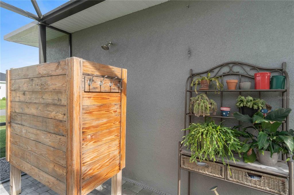 114 Venice Road Rotonda West, FL 33947 - Photo 45 of 88 a bathroom with a shower and a plant