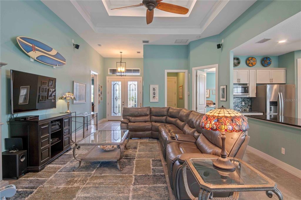 114 Venice Road Rotonda West, FL 33947 - Photo 48 of 88 a living room with furniture and a flat screen tv