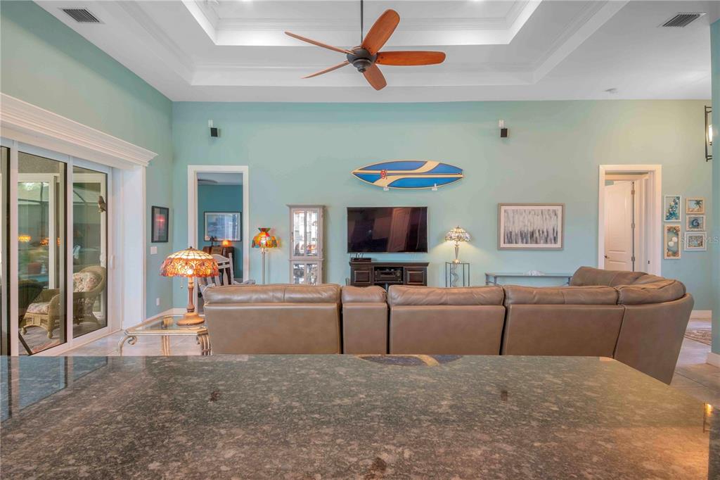 114 Venice Road Rotonda West, FL 33947 - Photo 51 of 88 a living room with furniture and a flat screen tv