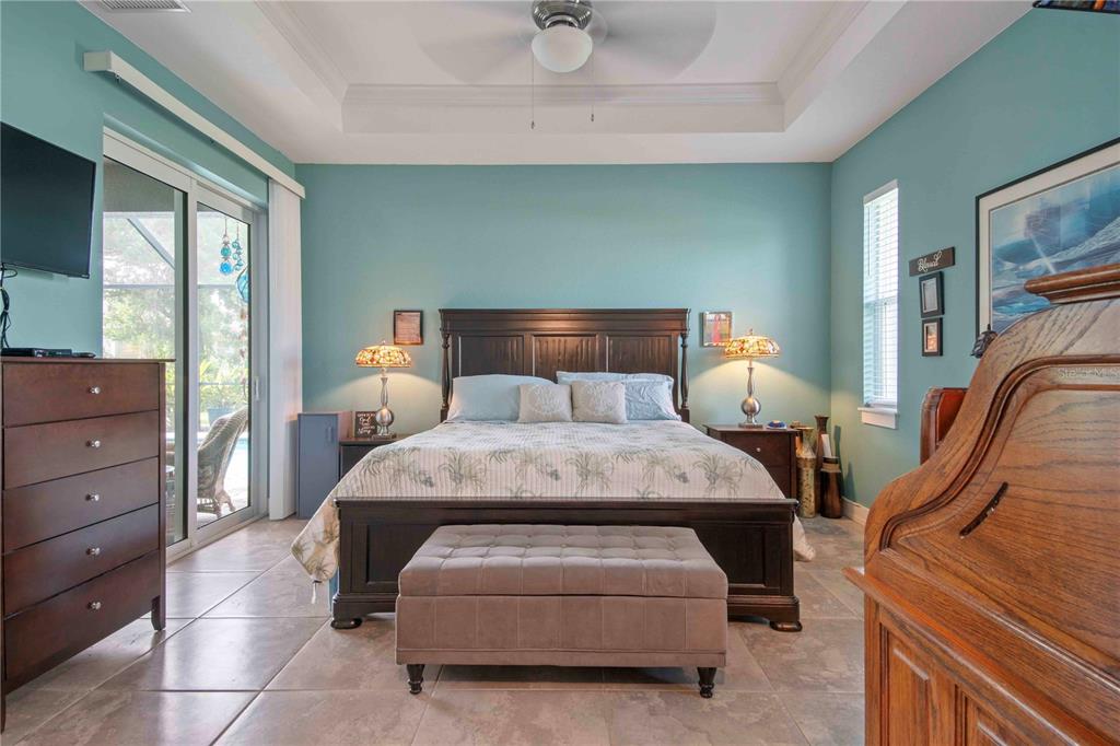 114 Venice Road Rotonda West, FL 33947 - Photo 53 of 88 a bed room with a bed and a night stand