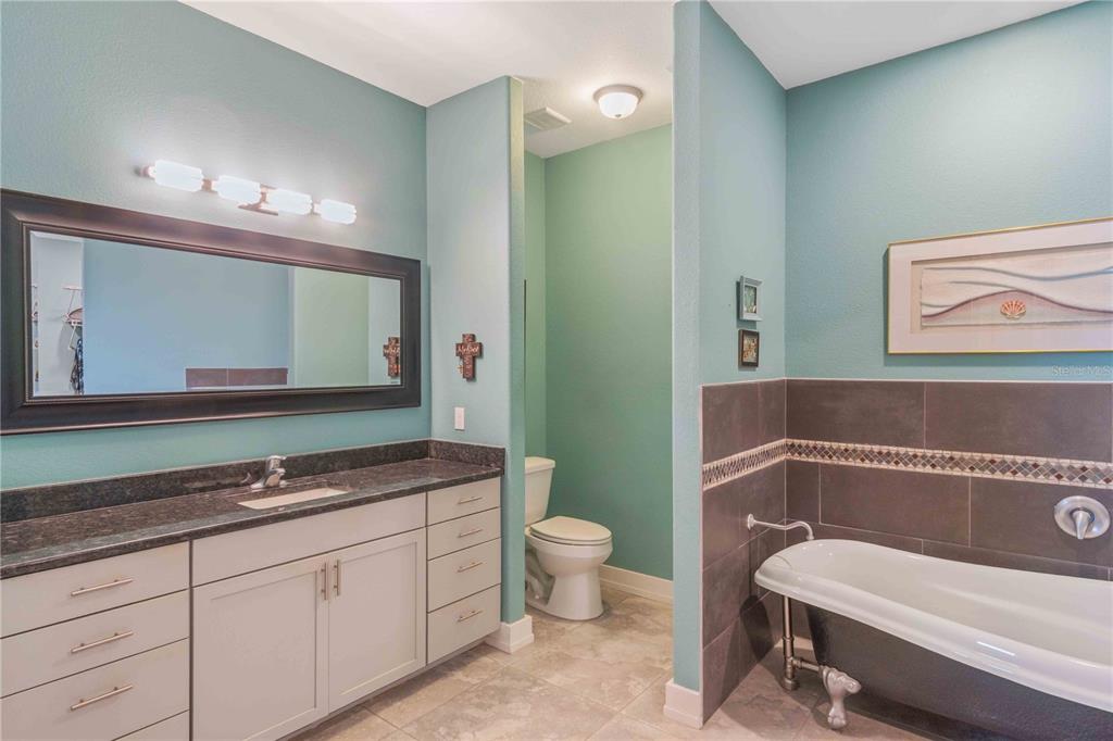 114 Venice Road Rotonda West, FL 33947 - Photo 65 of 88 a bathroom with a sink and a mirror