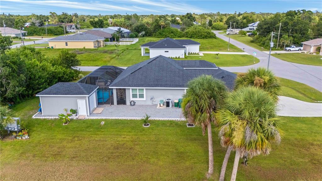 114 Venice Road Rotonda West, FL 33947 - Photo 82 of 88 a view of a house with a big yard