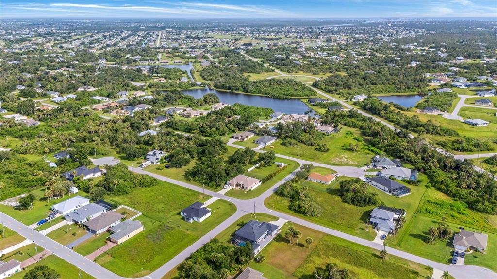 114 Venice Road Rotonda West, FL 33947 - Photo 87 of 88 an aerial view of residential houses with outdoor space