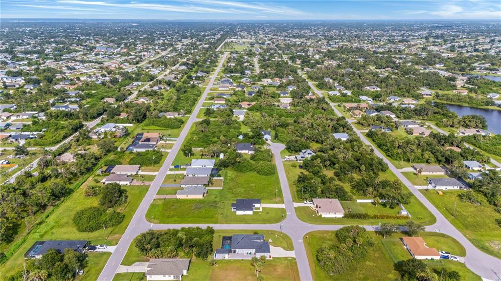 114 Venice Road Rotonda West, FL 33947 - Photo 88 of 88 an aerial view of residential houses with outdoor space