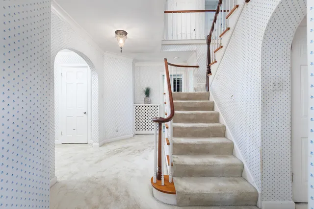 a view of a livingroom with an empty space and a window