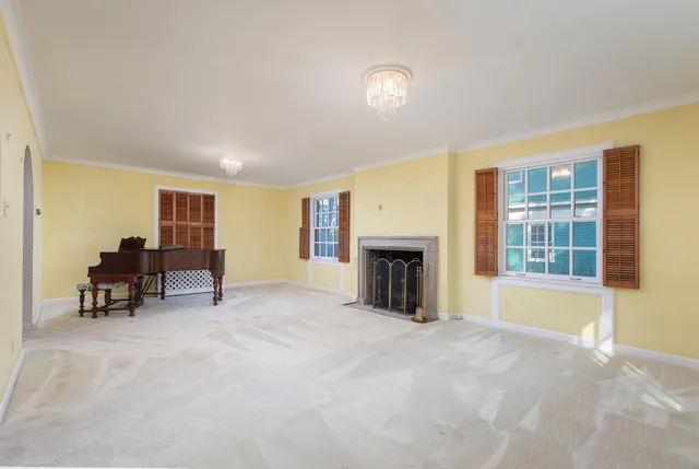 a large kitchen with stainless steel appliances wooden cabinets a sink and a stove