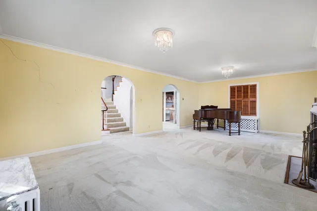 a view of empty room with a fireplace