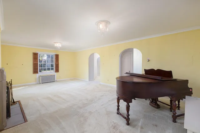 a view of a fireplace with a ceiling fan