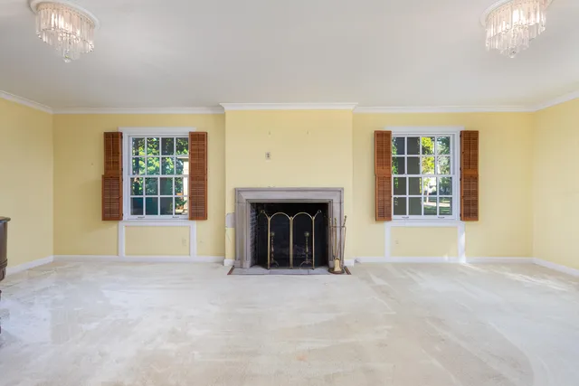 a view of empty room with wooden ceiling