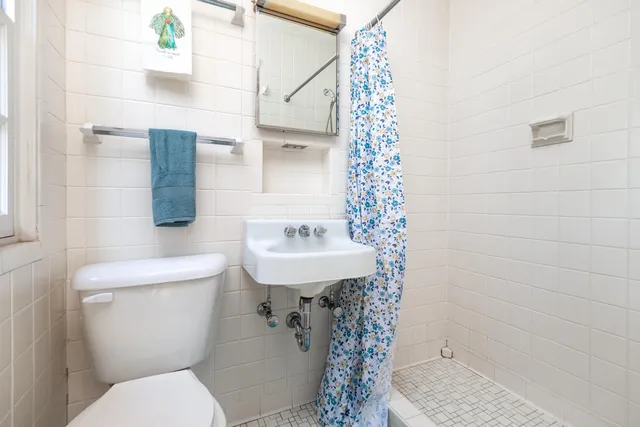 a view of a house with brick walls and windows