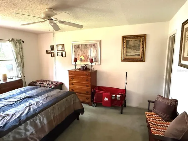 a bedroom with bed and window