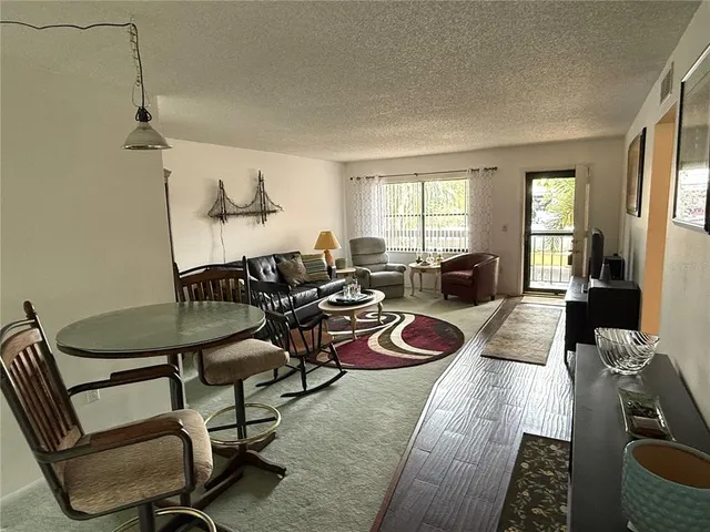 a view of a dining room with furniture window and outside view