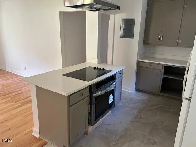 a kitchen with a stove and a refrigerator