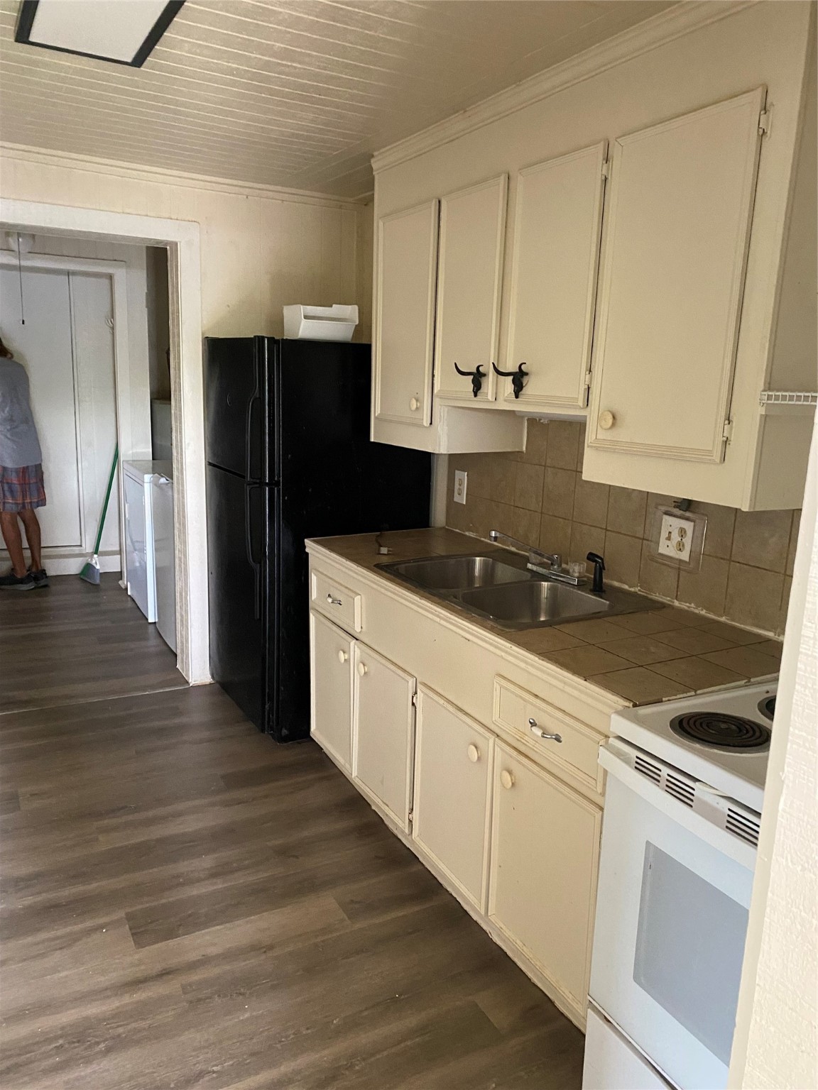 114 2nd Street San Leon, TX 77539 - Photo 5 of 14 a kitchen with granite countertop white cabinets and stainless steel appliances