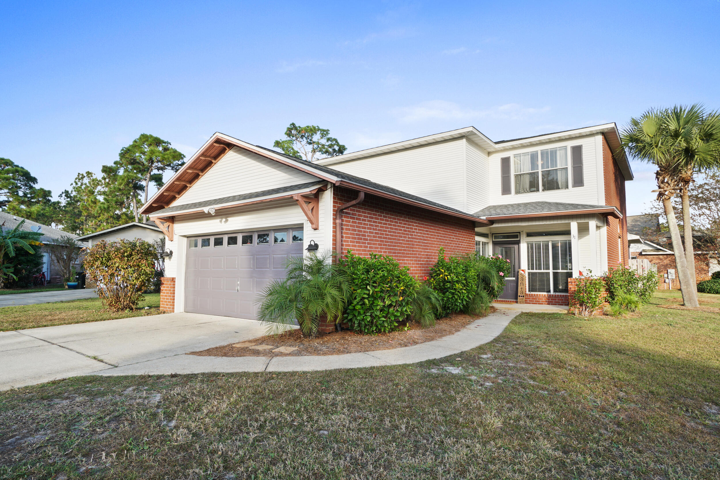 31 Corte Lago Santa Rosa Beach, FL 32459 - Photo 1 of 42 a front view of a house with garden