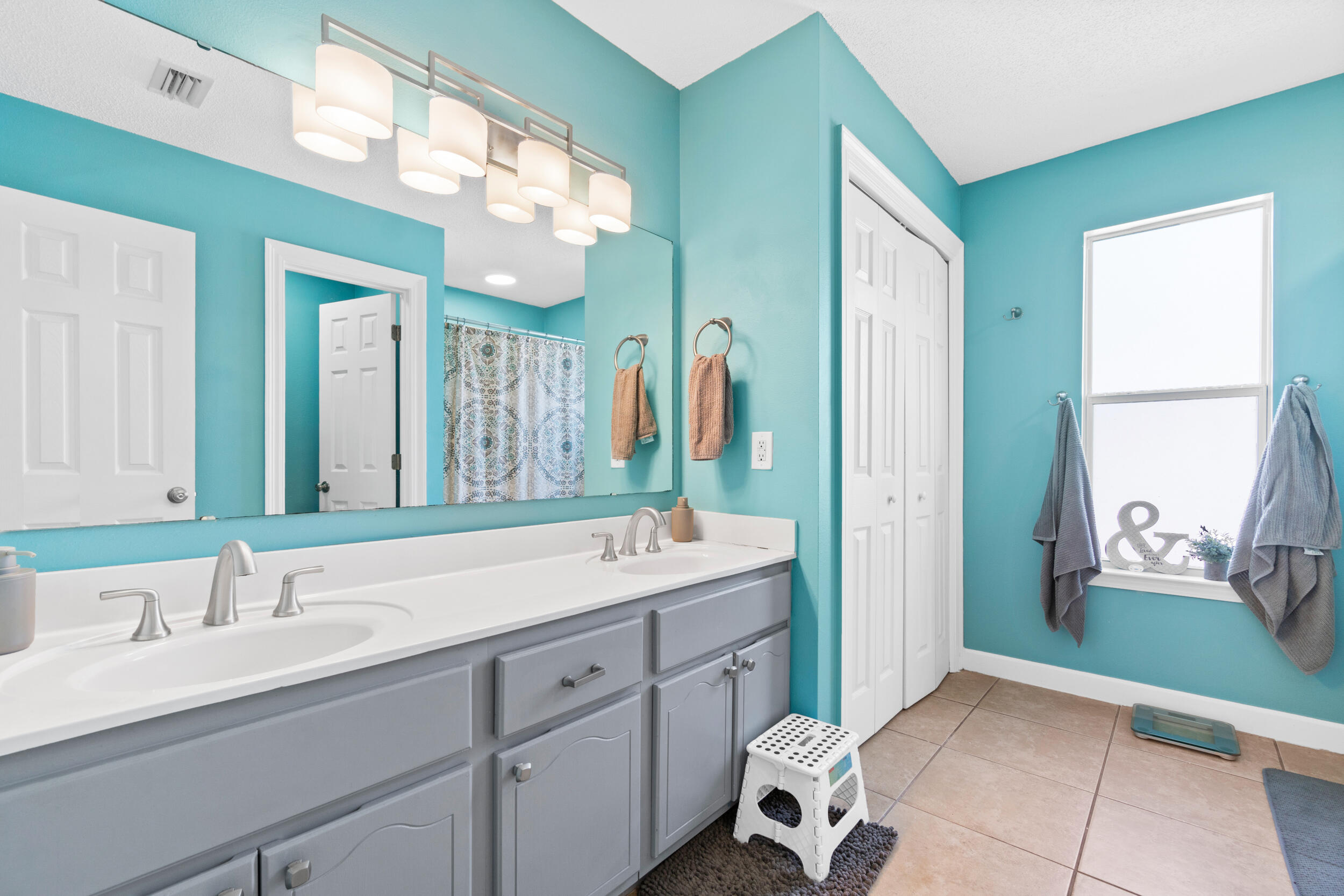 31 Corte Lago Santa Rosa Beach, FL 32459 - Photo 11 of 42 a bathroom with a sink and a mirror