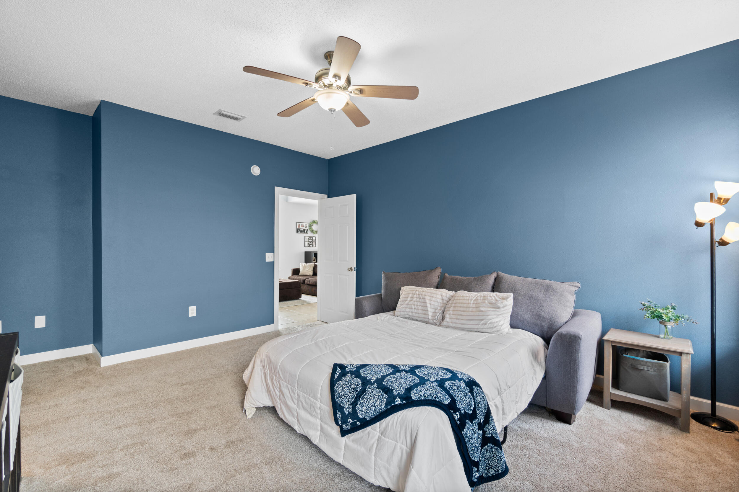 31 Corte Lago Santa Rosa Beach, FL 32459 - Photo 15 of 42 a bedroom with a bed and a chandelier