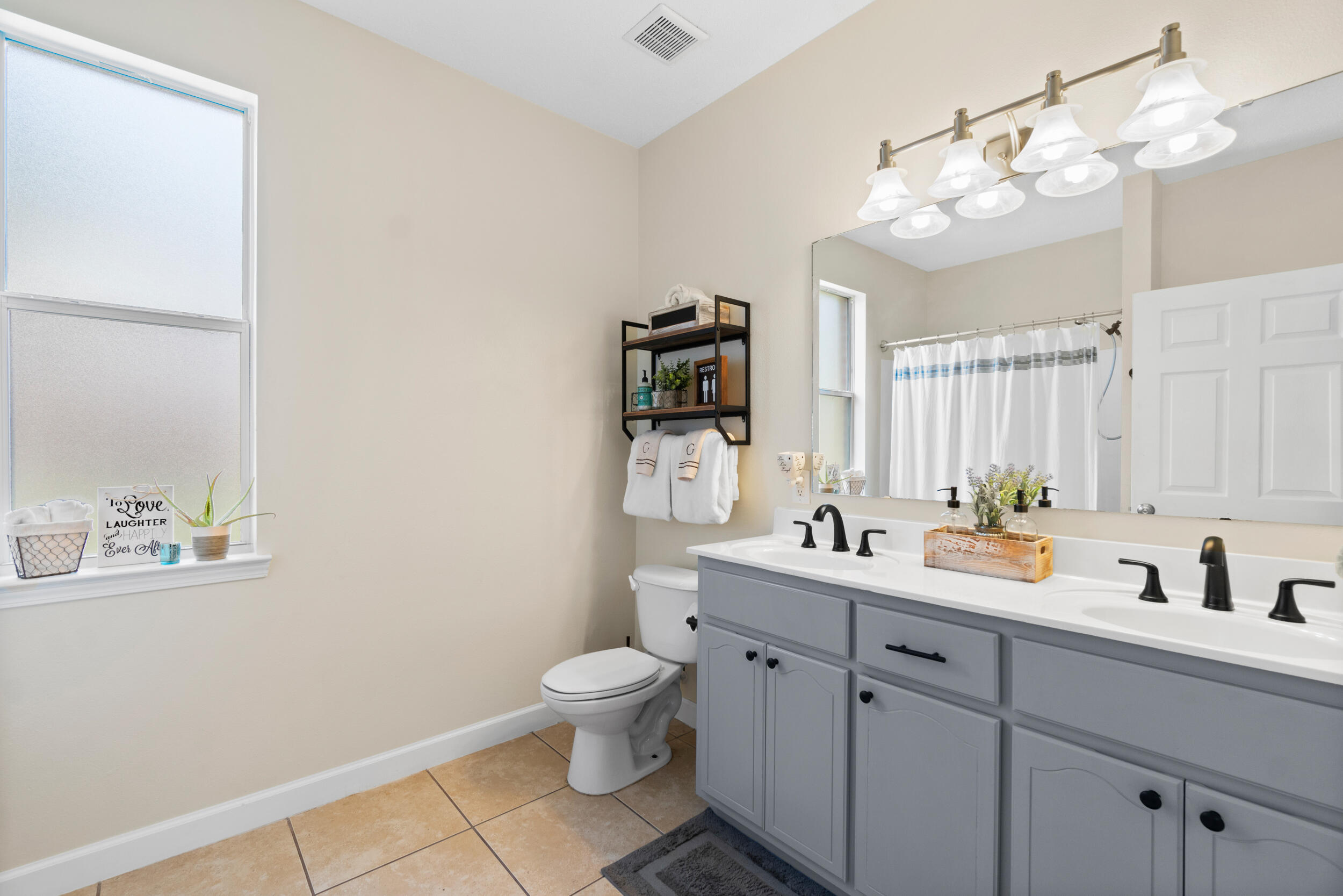 31 Corte Lago Santa Rosa Beach, FL 32459 - Photo 17 of 42 a bathroom with a toilet sink and mirror