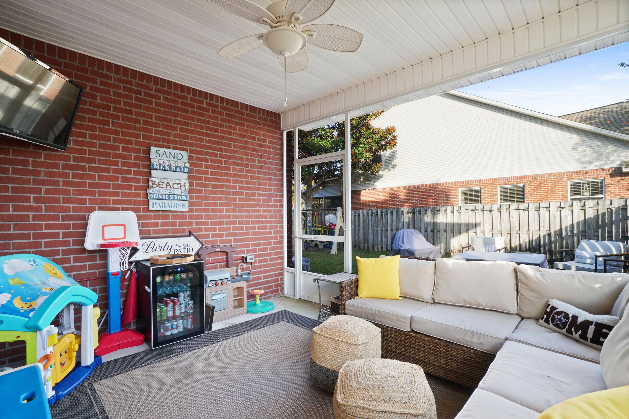 31 Corte Lago Santa Rosa Beach, FL 32459 - Photo 20 of 42 a living room filled with furniture and a flat screen tv