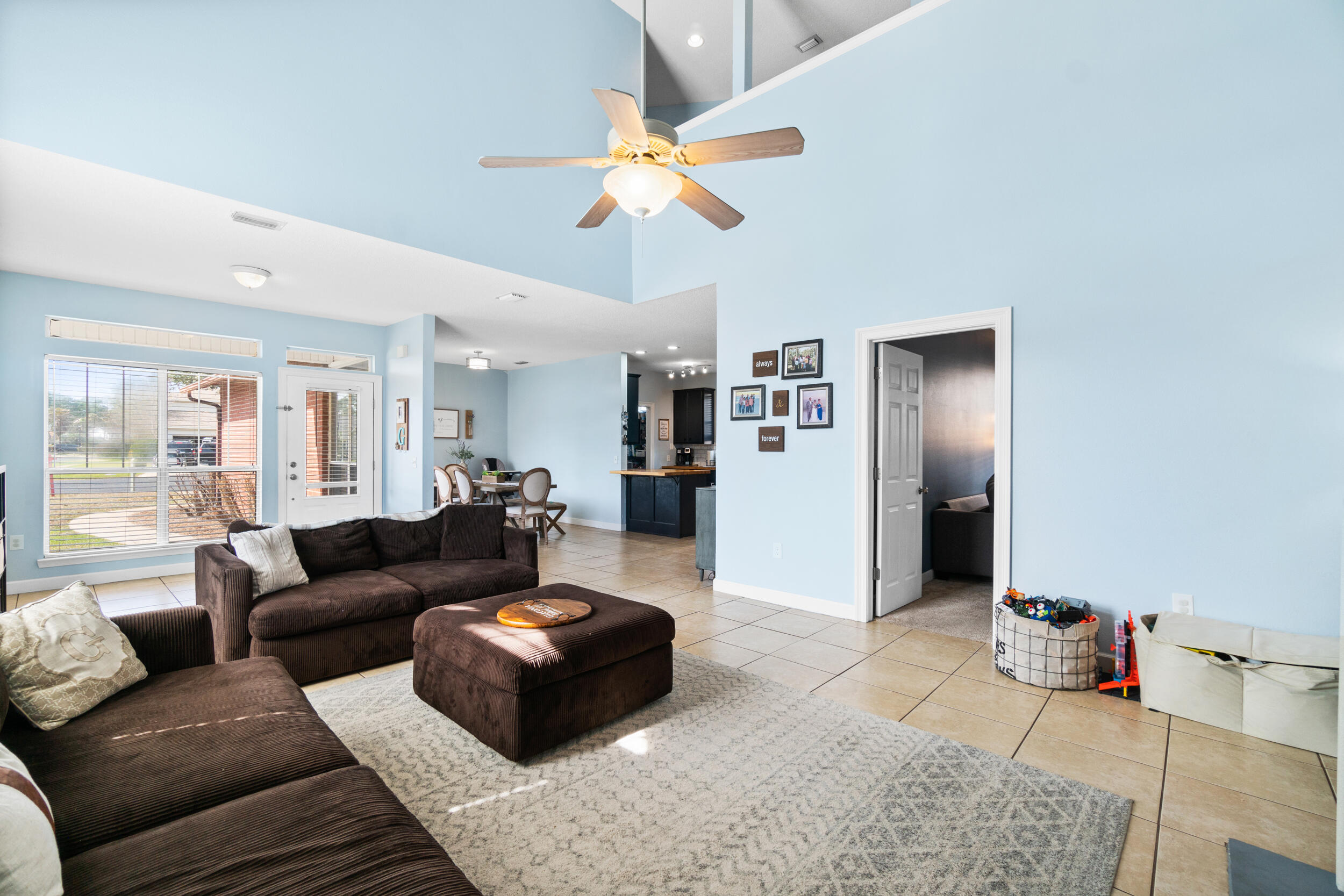 31 Corte Lago Santa Rosa Beach, FL 32459 - Photo 2 of 42 a living room with furniture and a chandelier
