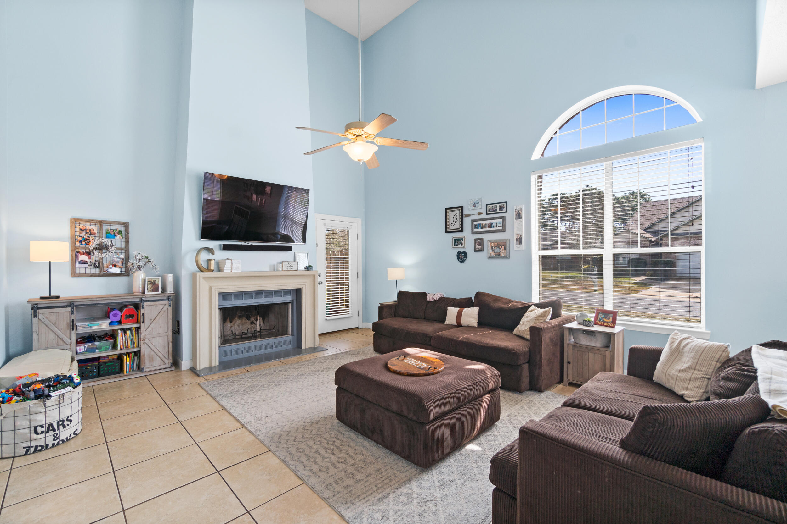 31 Corte Lago Santa Rosa Beach, FL 32459 - Photo 3 of 42 a living room with furniture a fireplace and a flat screen tv