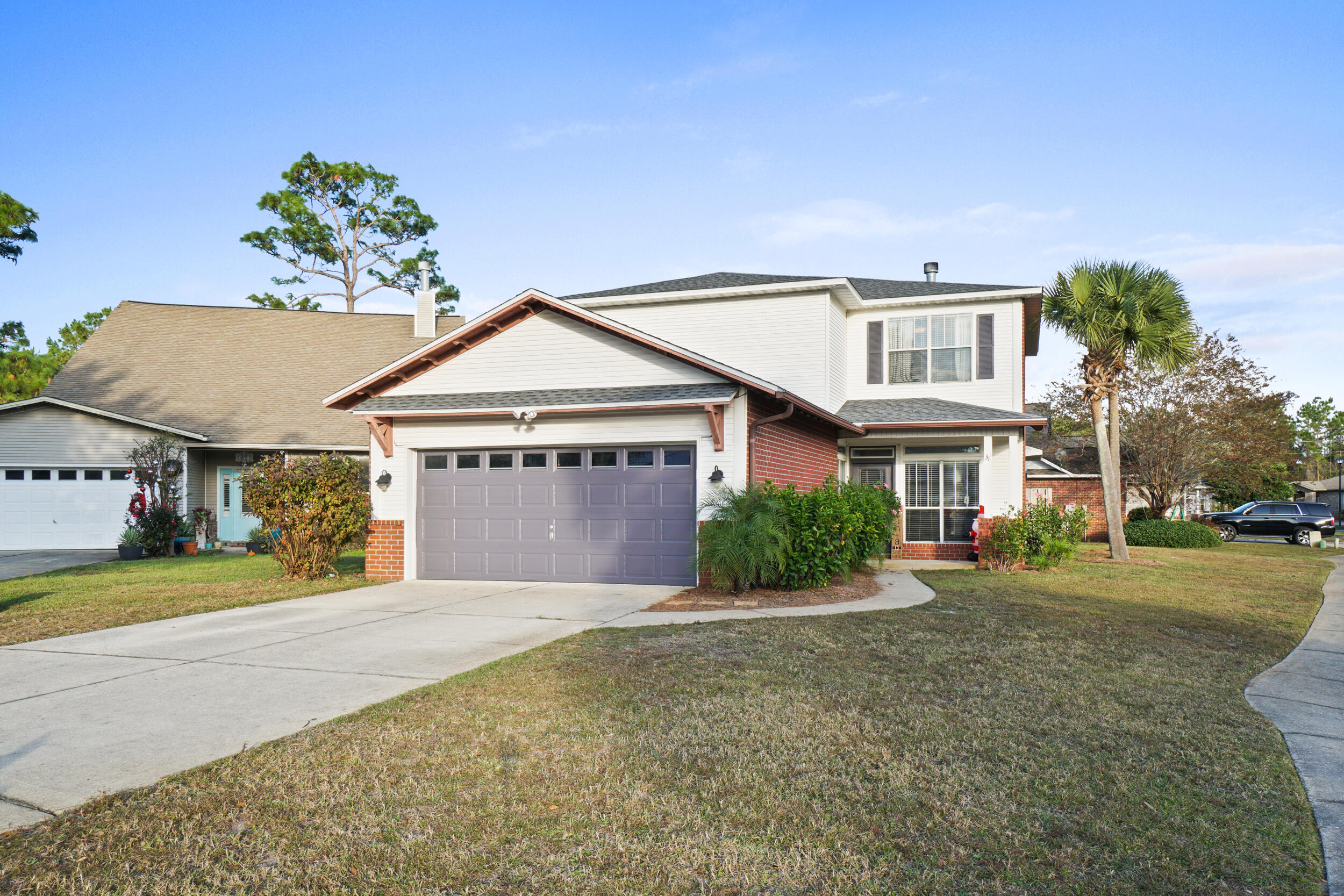 31 Corte Lago Santa Rosa Beach, FL 32459 - Photo 31 of 42 a front view of a house with a garden and trees