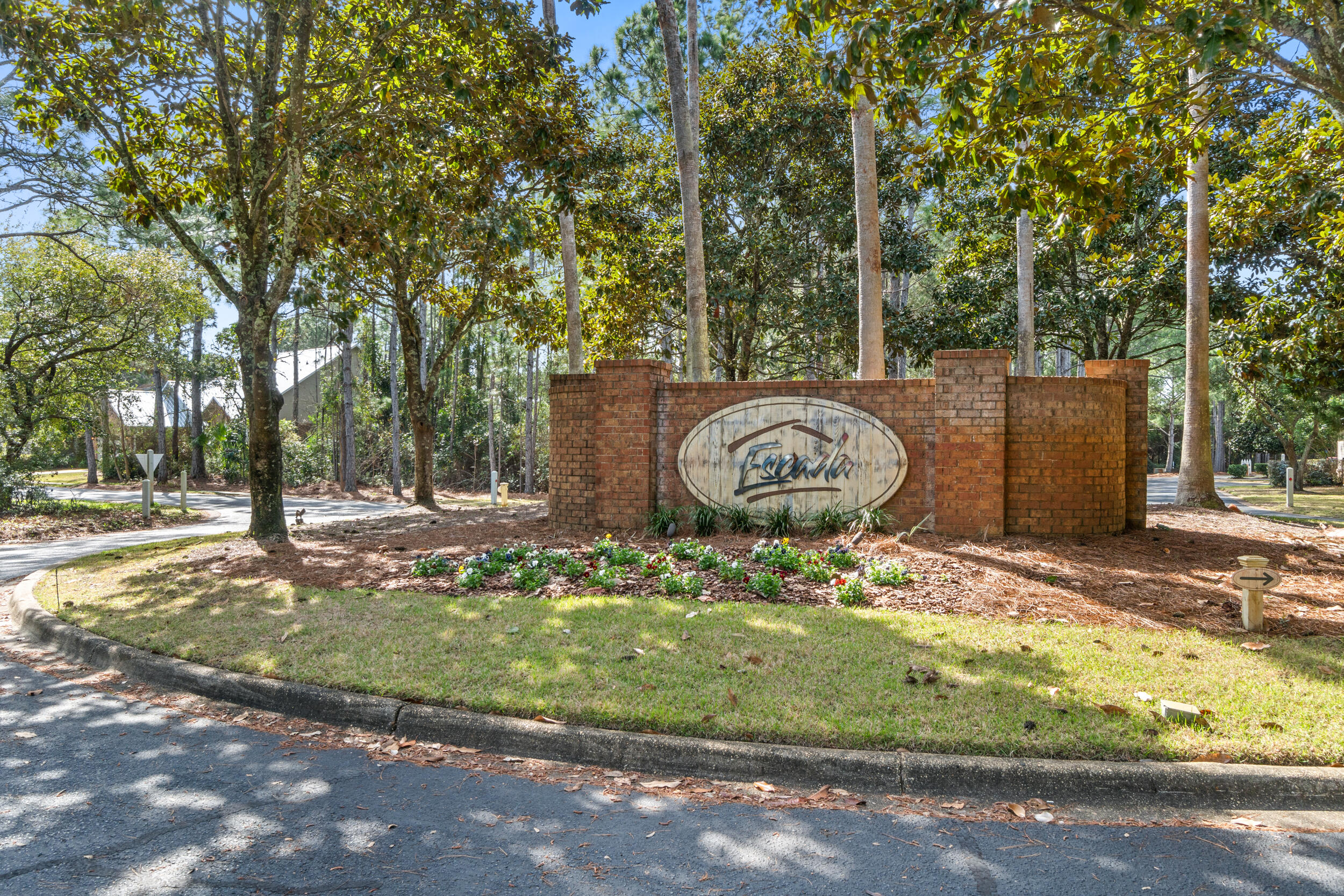 31 Corte Lago Santa Rosa Beach, FL 32459 - Photo 34 of 42 a wooden bench with trees in the background